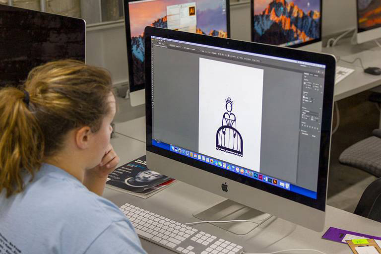 woman with drafting software open on computer