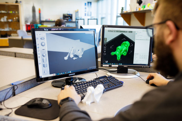 student working on 3d modeling software